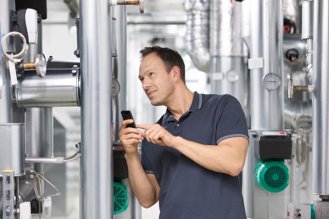 Installer Sascha working in boiler room