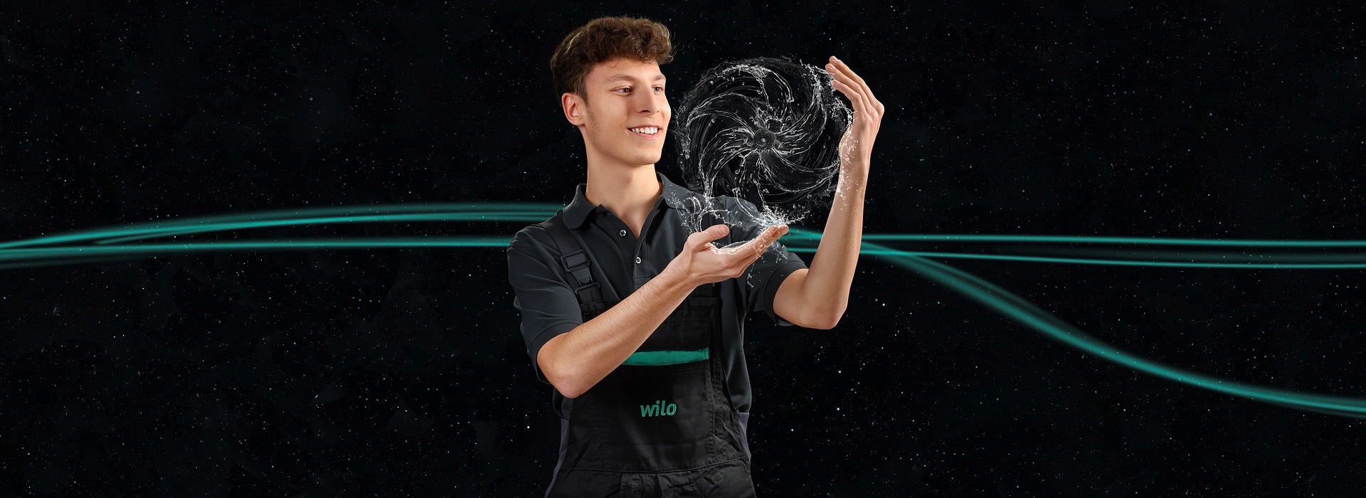 Portrait of surprised young man with impeller looking up in front of black background Portrait of surprised young man with impeller looking up in front of black background