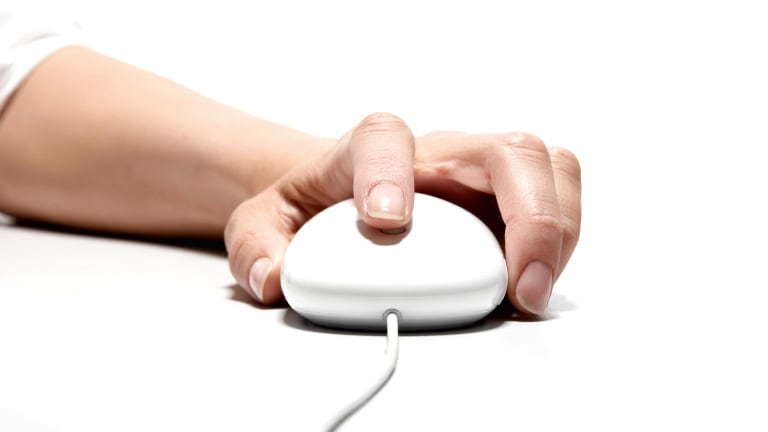 Woman's Hand on Computer Mouse