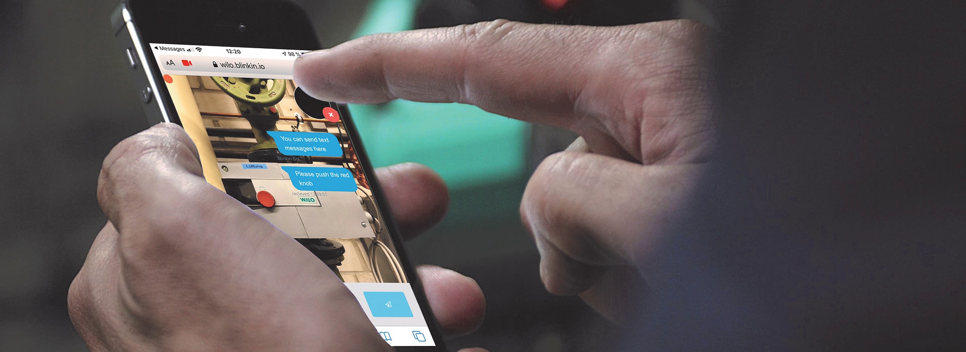 A smartphone showing the Wilo service team providing digital support during a repair. a-smartphone-showing-the-wilo-service-team-providing-digital-support-during-a-repair