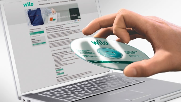 Laptop CD-ROM in hand