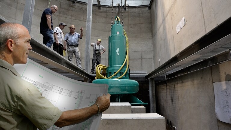 submersible pump being installed in dry pit