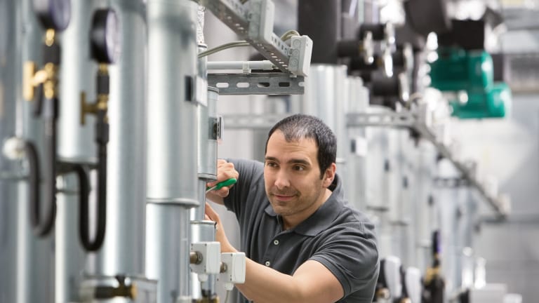 Installer Jesus working in boiler room