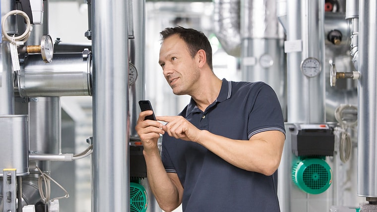 Installer Sascha working in boiler room