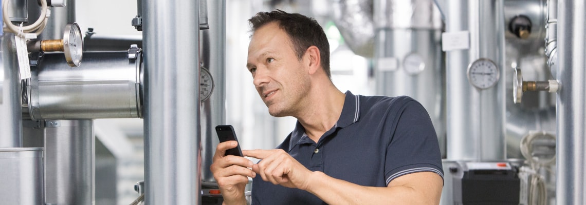 Installer Sascha working in boiler room