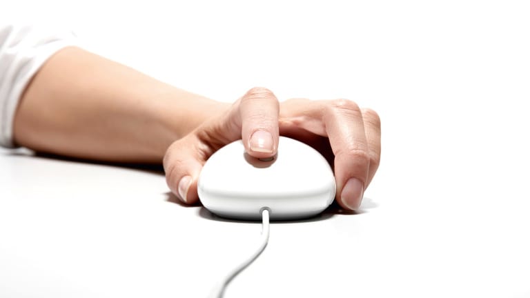 Woman's Hand on Computer Mouse