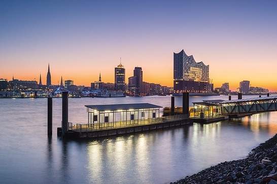 View over the Elbe river in Hamburg germany. Port of Hamburg in the morning with some of the famous landmarks in the background.