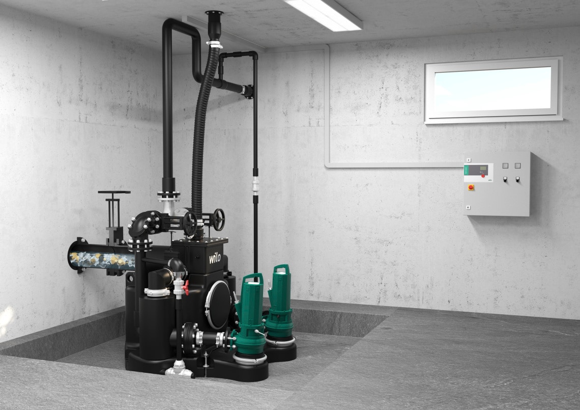 Wilo-EMUport CORE installiert im Gebäude/Keller mit Wilo-Schaltgerät, hoher Anteil an Feststoffen im Abwasser sichtbar