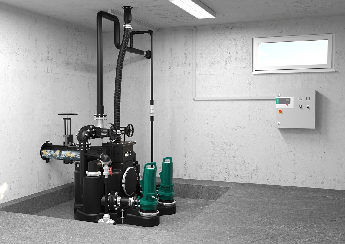 Wilo-EMUport CORE installiert im Gebäude/Keller mit Wilo-Schaltgerät, hoher Anteil an Feststoffen im Abwasser sichtbar