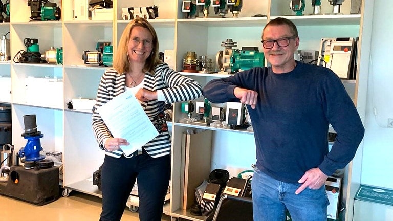 MD Kirsten Bradley with advisor Dirk Oorthuizen from Wri-Tech B.V. after takeover meeting. And Picture of Wri-Tech office building with employees.