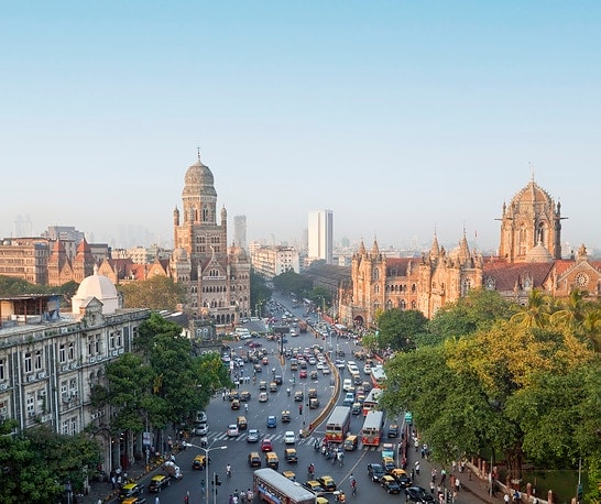 View over Victoria terminus or Chhatrapati Shivaji terminus (CST) and central Mumbai at dusk Mumbai India