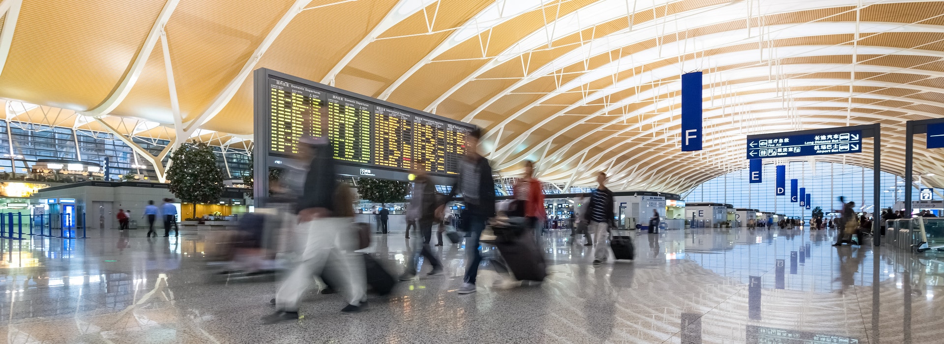 scenes in shanghai pudong international airport lobby and passengers motion blur