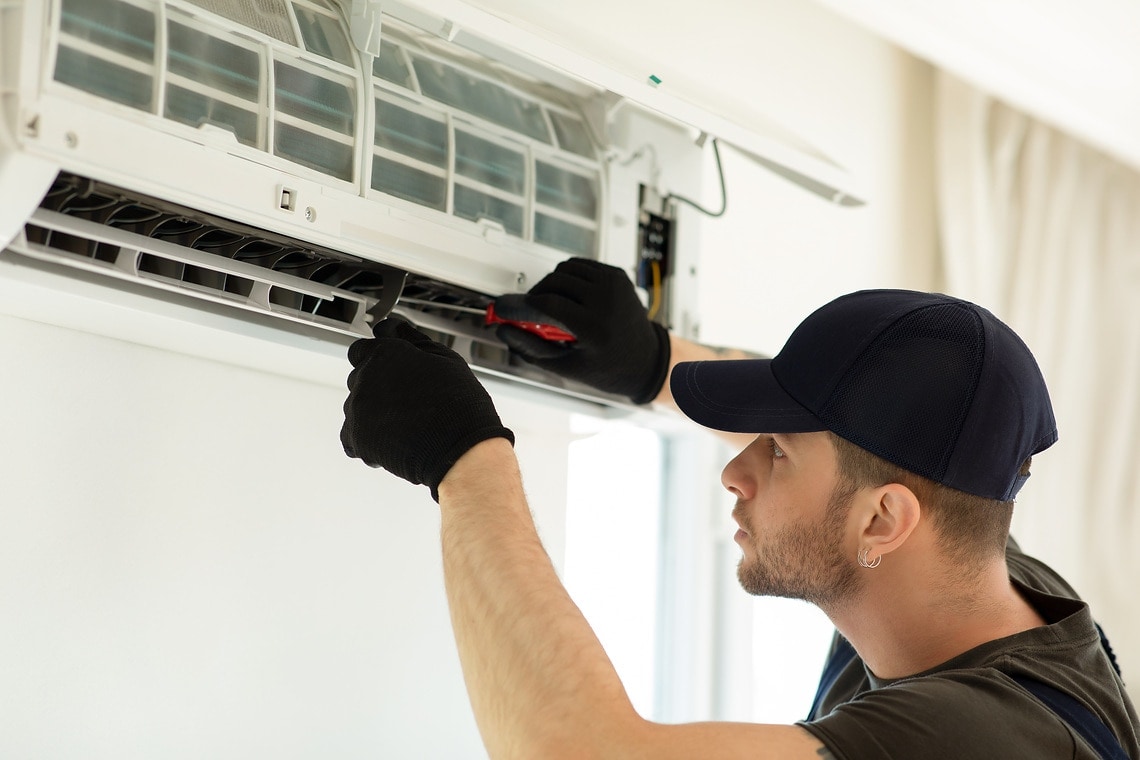 Man repairs Air Conditioning