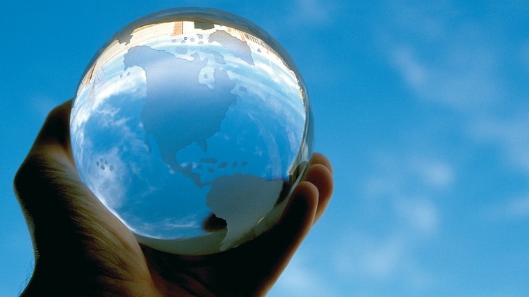 Hand with glass globe