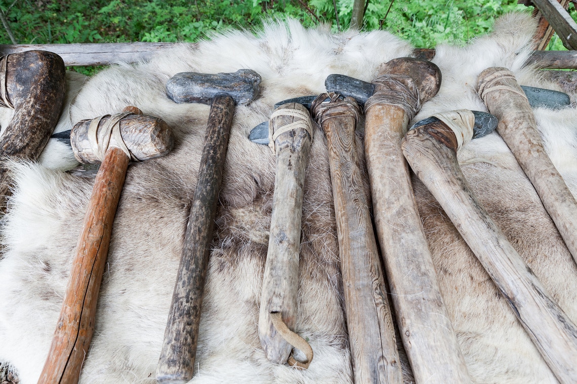 Handmade stone age axes in a row