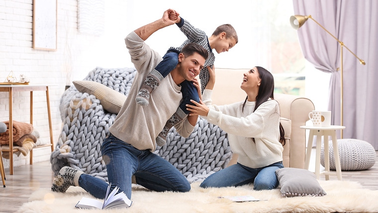 Happy family with little son having fun at home. Winter vacation