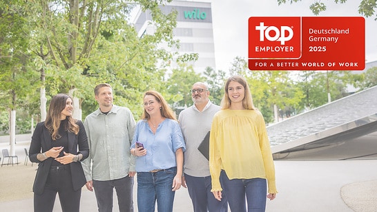 Wilo Employees on the Wilopark with the Top Employeer Logo
