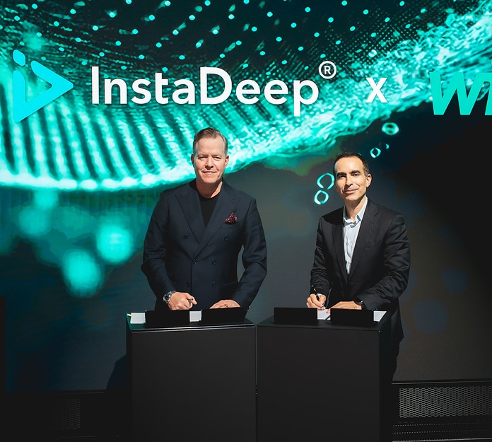 Oliver Hermes, President & Global CEO of the Wilo Group (left), and Karim Beguir, CEO and Co Founder of InstaDeep, during the signing of the partnership agreement in the Networking Cube at Wilopark.