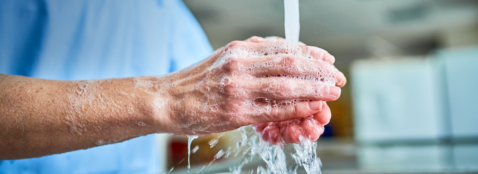 A person washing hands in a hospital